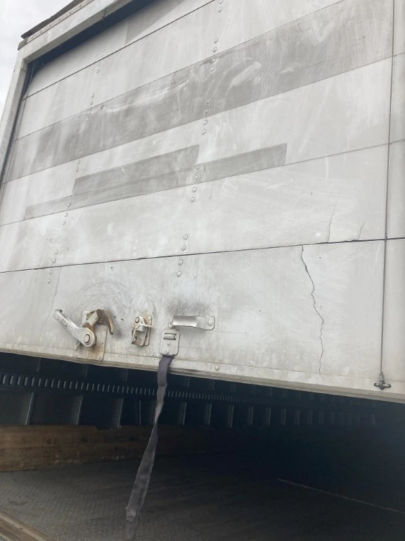 Roll-up door panel repair on a commercial truck in San Diego