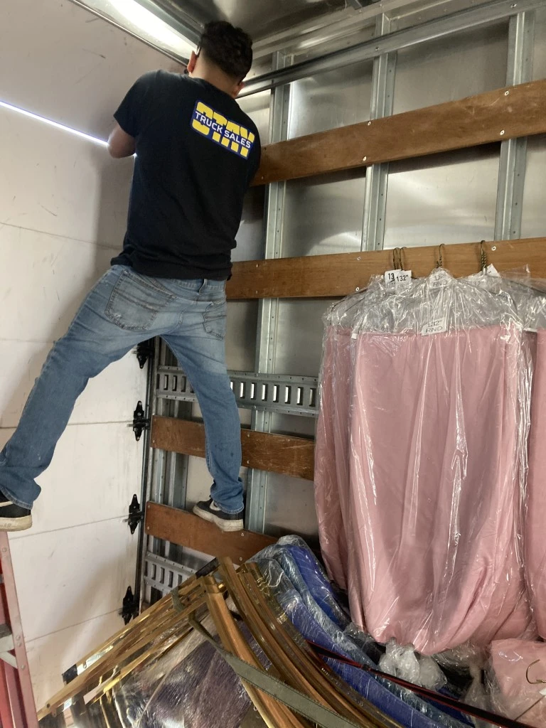 Roll-up door roller and panel repair on a box truck in San Diego
