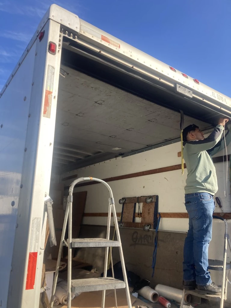 Roll-up door on a commercial box truck repaired by HD Truck Body in San Diego