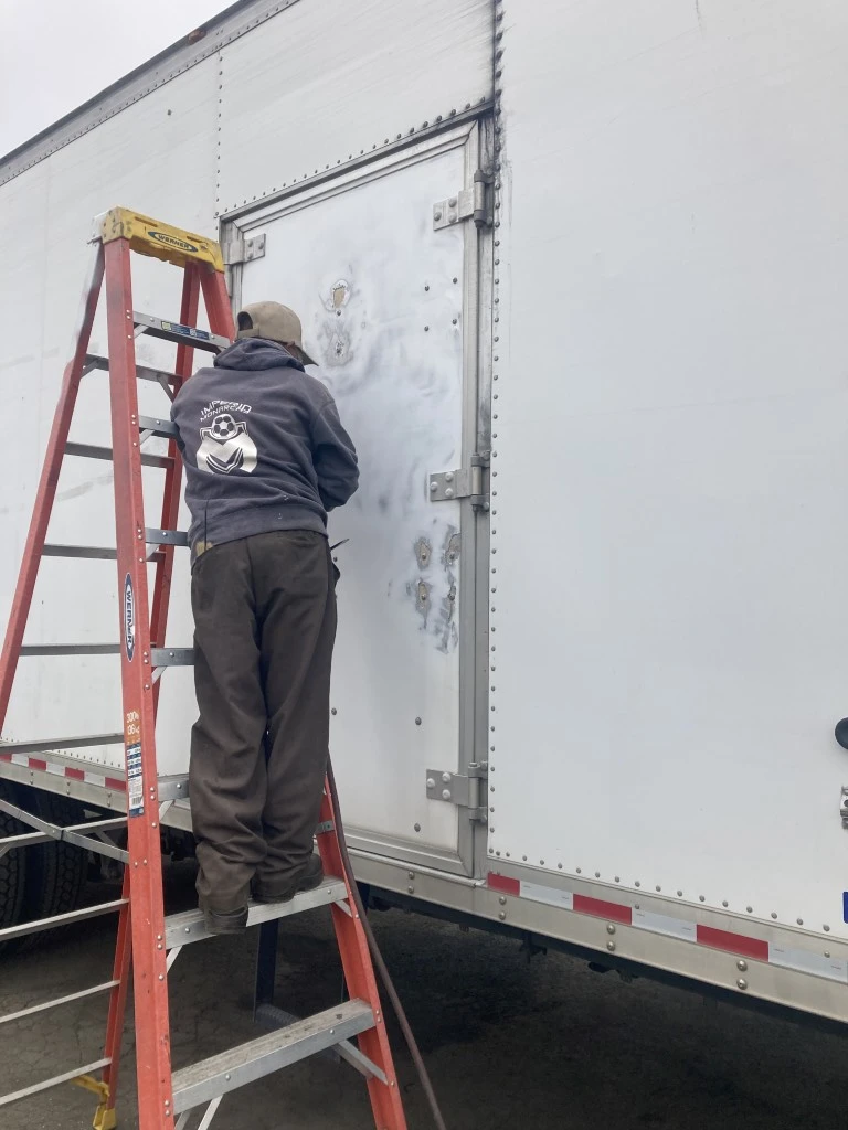 Side door fabrication and installation on a truck body at HD Truck Body San Diego
